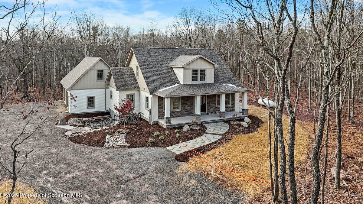 434 Summit Woods Road Moscow, PA 18444 - Photo 1 of 19 a front view of a house with entertaining space