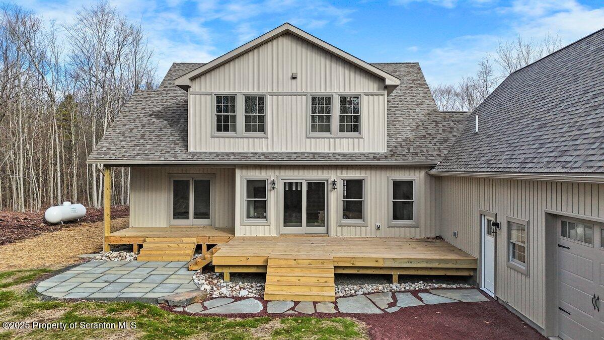 434 Summit Woods Road Moscow, PA 18444 - Photo 11 of 19 a view of a house with backyard and sitting area