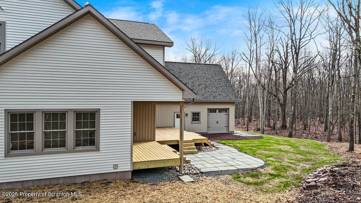 434 Summit Woods Road Moscow, PA 18444 - Photo 15 of 19 a view of a house with a yard and sitting area
