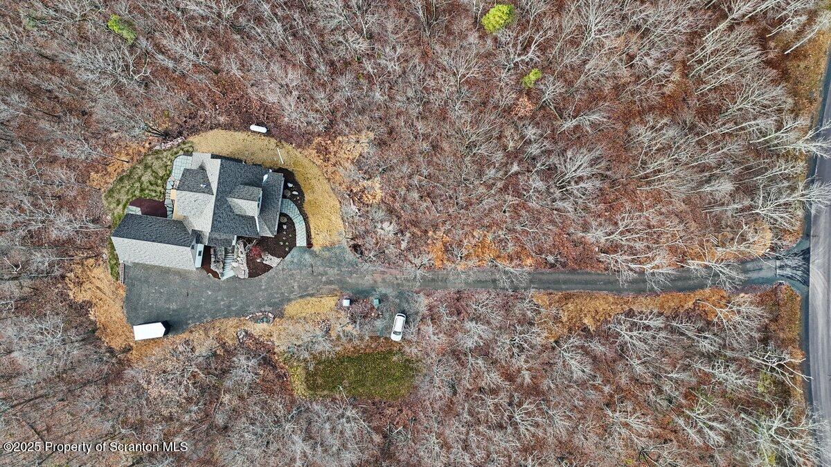 434 Summit Woods Road Moscow, PA 18444 - Photo 16 of 19 a view of a house with a yard
