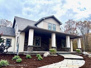 434 Summit Woods Road Moscow, PA 18444 - Photo 19 of 19 a front view of a house with garden