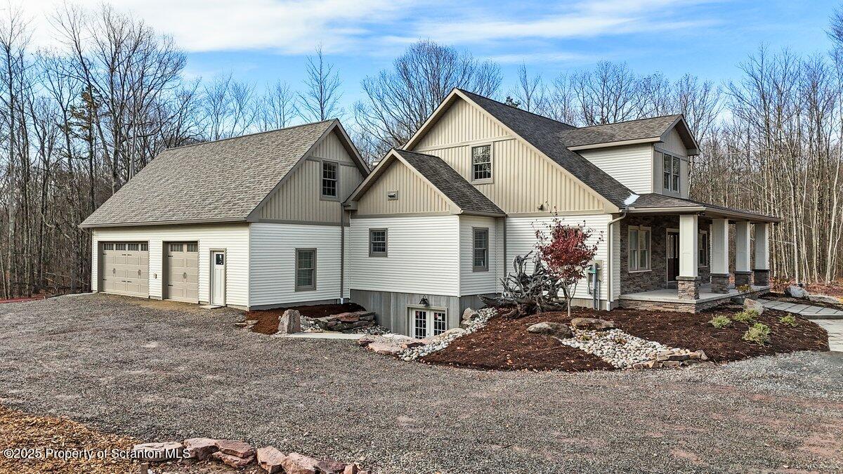 434 Summit Woods Road Moscow, PA 18444 - Photo 2 of 19 a view of a house with a patio