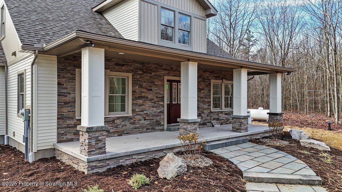 434 Summit Woods Road Moscow, PA 18444 - Photo 6 of 19 a front view of a house with outdoor seating