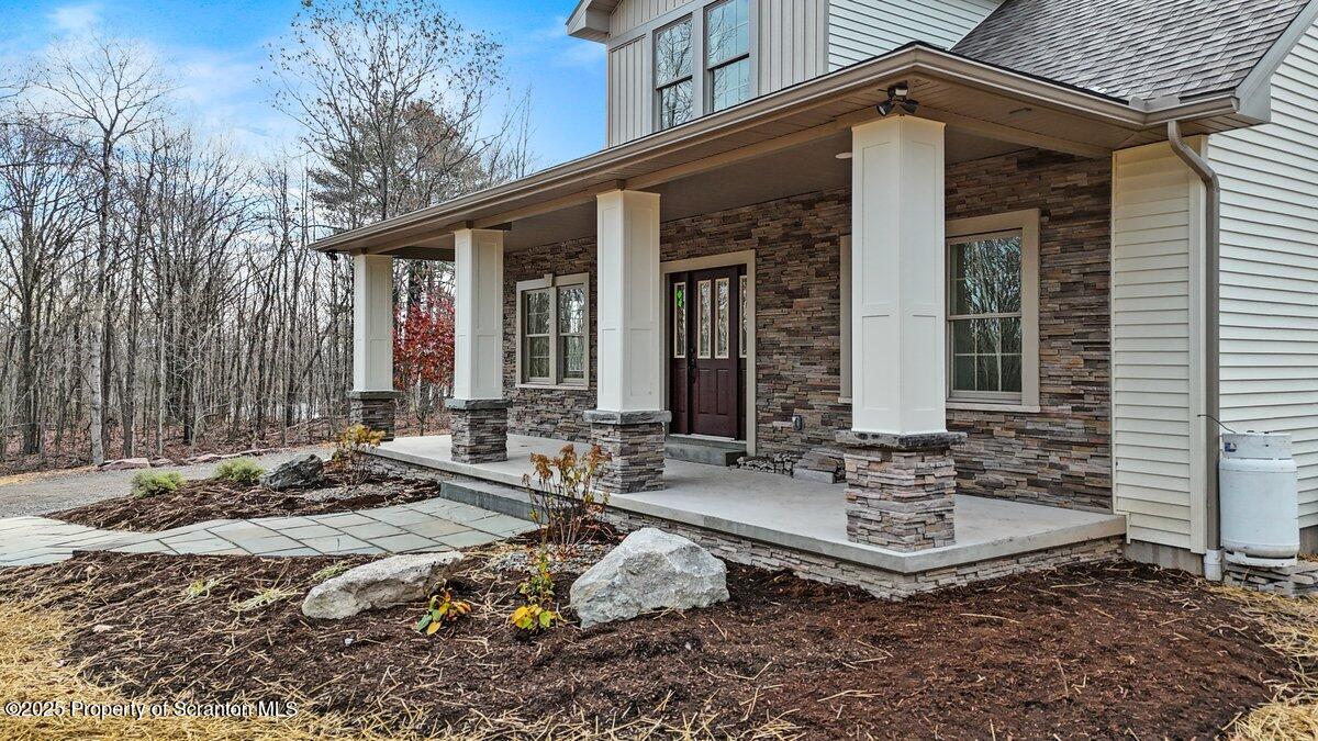 434 Summit Woods Road Moscow, PA 18444 - Photo 7 of 19 a view of a house with backyard and sitting area
