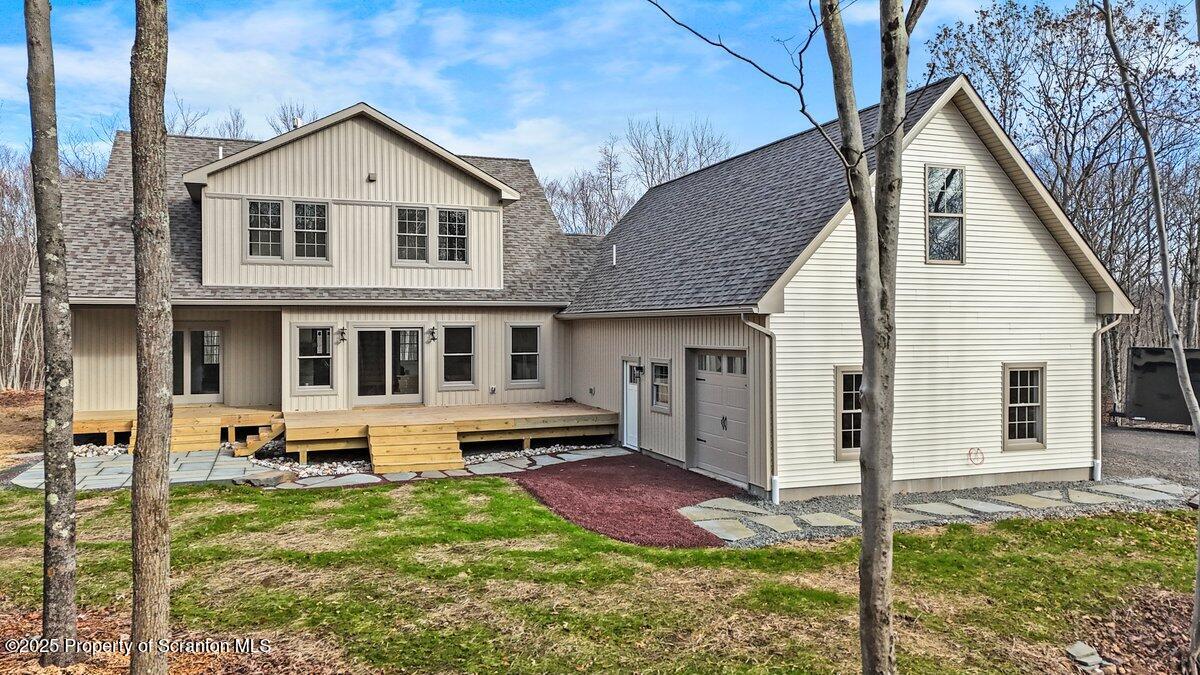 434 Summit Woods Road Moscow, PA 18444 - Photo 9 of 19 a front view of a house with garden