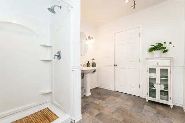 a bathroom with a sink and a shower