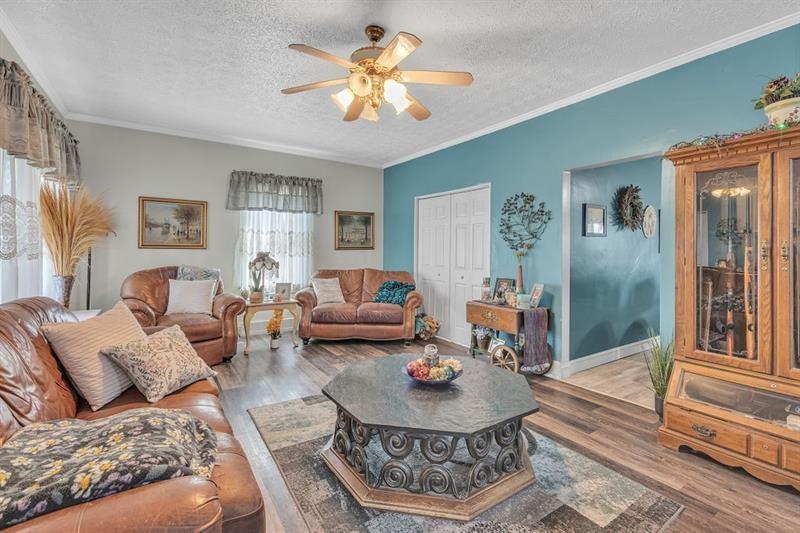 3159 Brodhead Road Aliquippa, PA 15001 - Photo 3 of 30 a living room with furniture and a chandelier