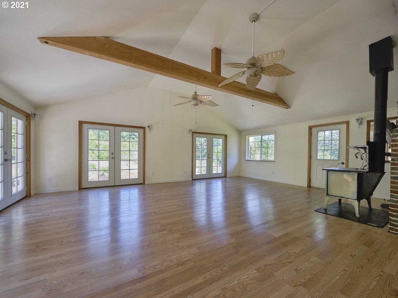 6121 Northeast Lessard Road Camas, WA 98607 - Photo 22 of 26 a view of an empty room with wooden floor and a window