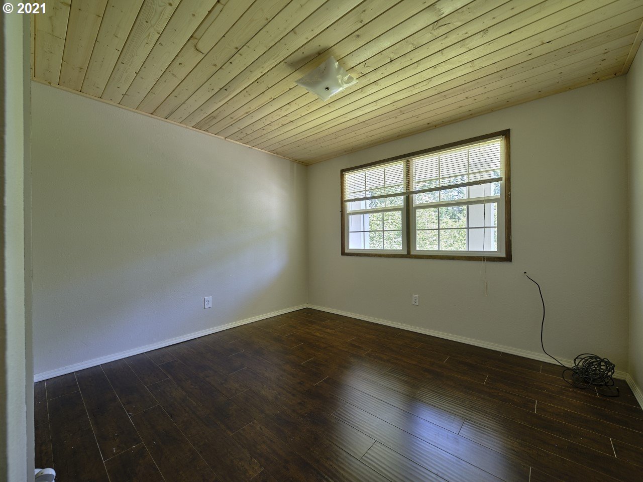6121 Northeast Lessard Road Camas, WA 98607 - Photo 23 of 26 an empty room with wooden floor and windows