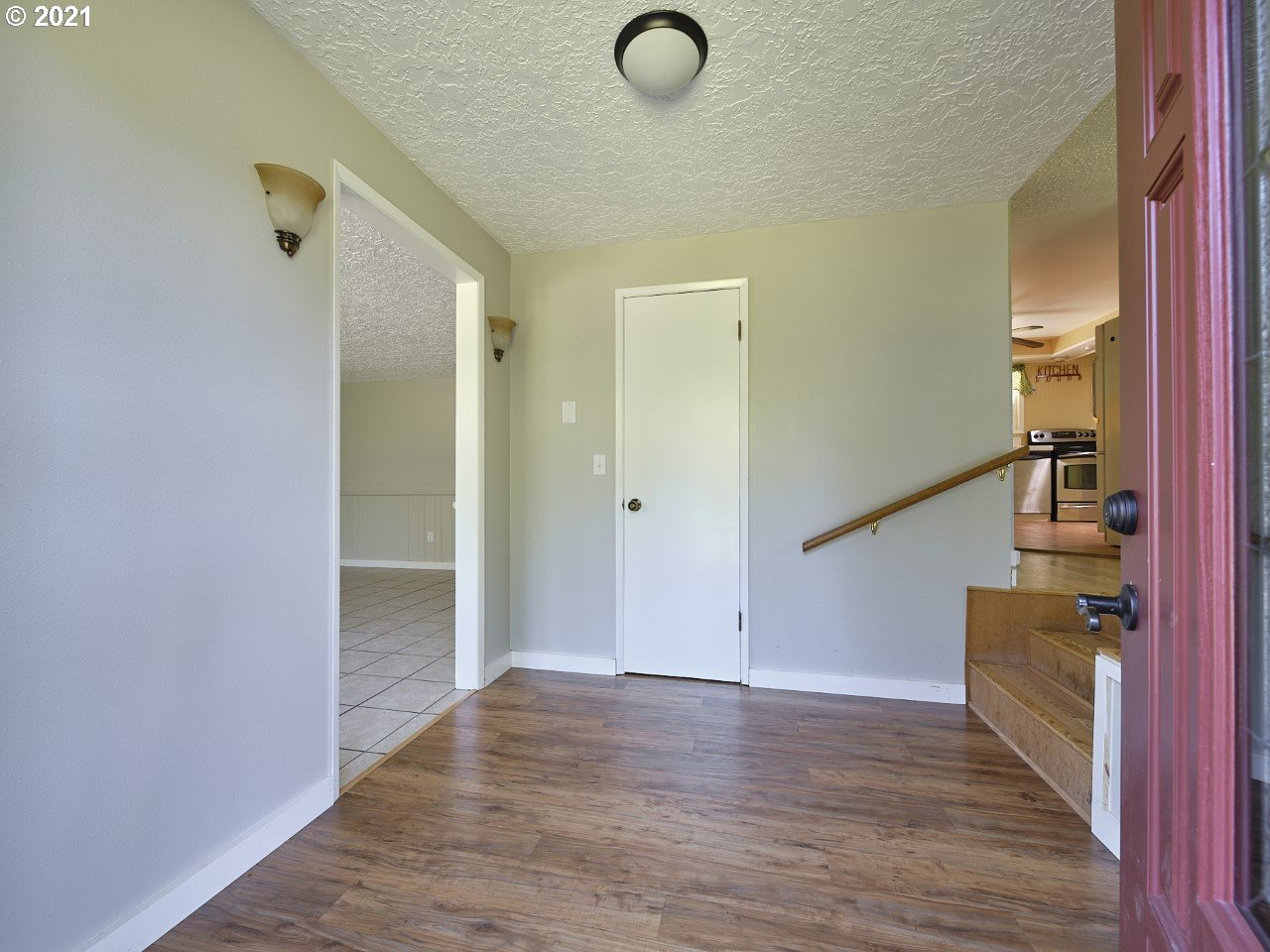 6121 Northeast Lessard Road Camas, WA 98607 - Photo 7 of 26 a view of a hallway with wooden floor and staircase