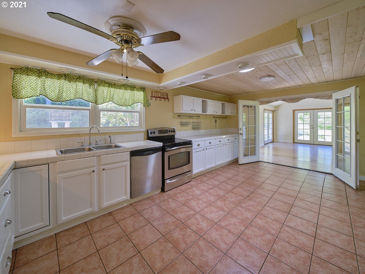 6121 Northeast Lessard Road Camas, WA 98607 - Photo 10 of 26 a large kitchen with cabinets and wooden floor