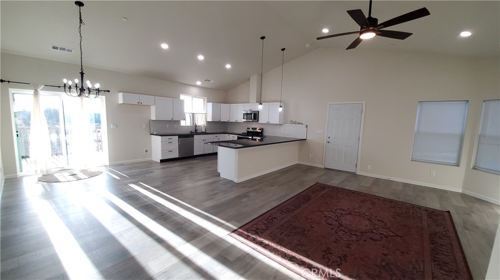 6282 Hartnell Court Magalia, CA 95954 - Photo 12 of 33 a kitchen with stainless steel appliances granite countertop a sink stove and refrigerator