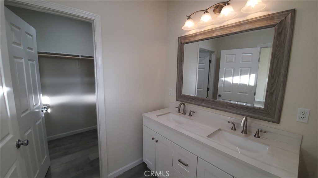 6282 Hartnell Court Magalia, CA 95954 - Photo 18 of 33 a bathroom with a double vanity sink and mirror