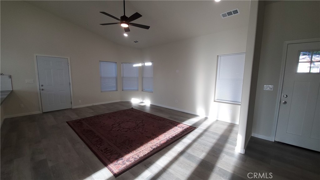 6282 Hartnell Court Magalia, CA 95954 - Photo 23 of 33 a living room with a rug and a ceiling fan