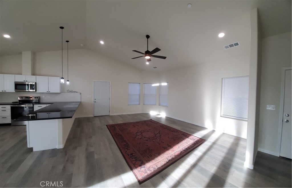 6282 Hartnell Court Magalia, CA 95954 - Photo 25 of 33 a large kitchen with cabinets a sink and stainless steel appliances