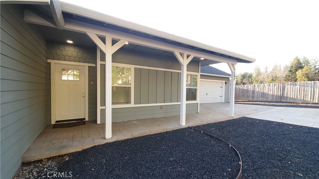 6282 Hartnell Court Magalia, CA 95954 - Photo 8 of 33 a view of a porch with wooden floor and fence