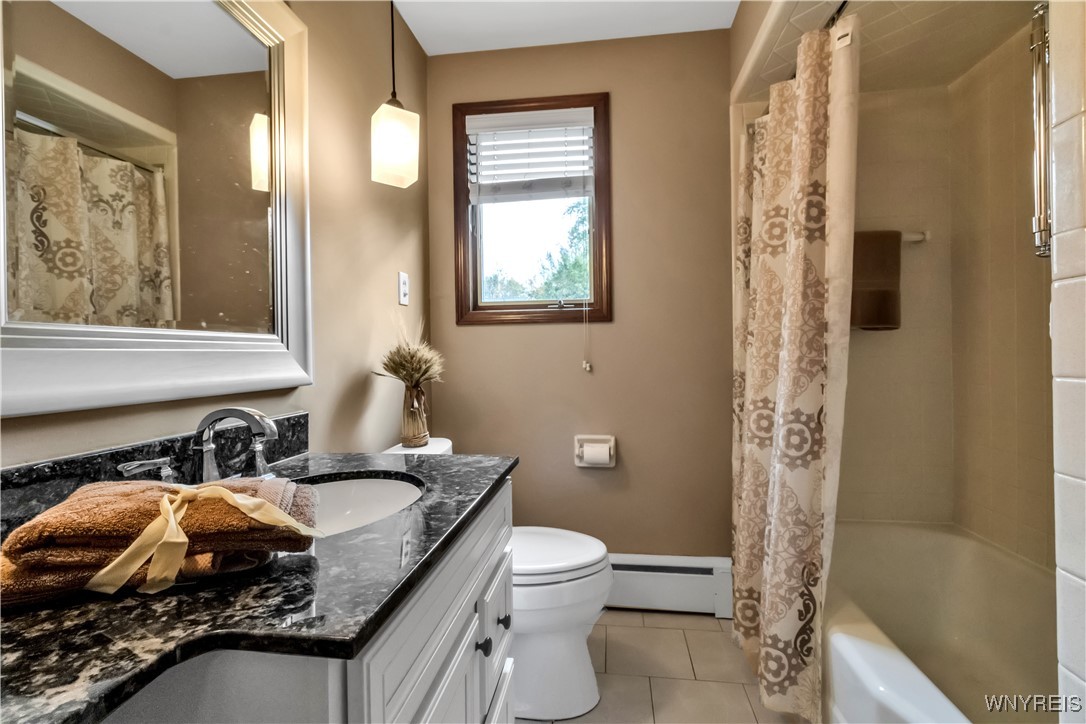 303 Seneca Place Lancaster, NY 14086 - Photo 13 of 31 Tiled tub/shower and tiled floor