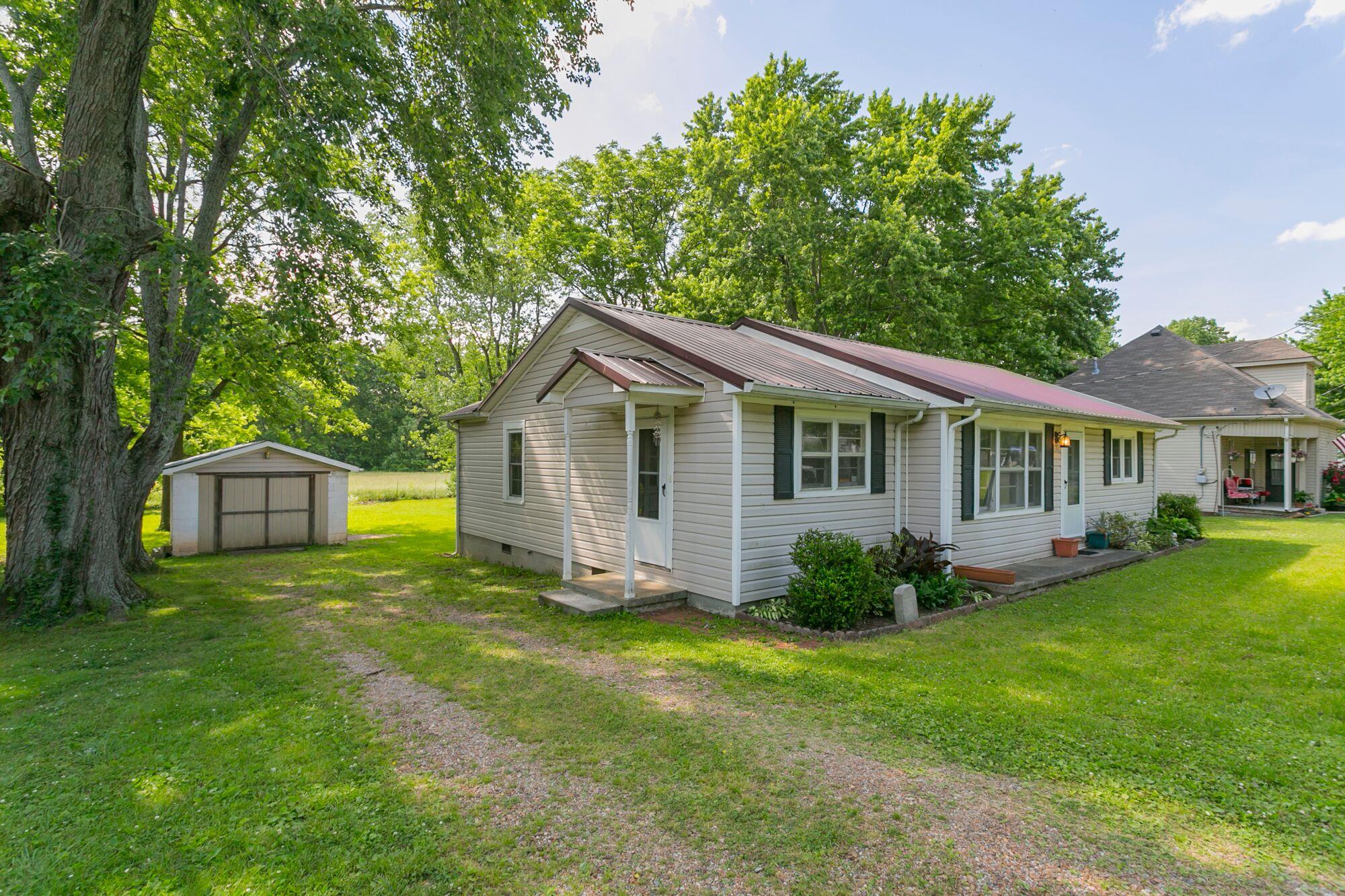 a view of a house with a yard