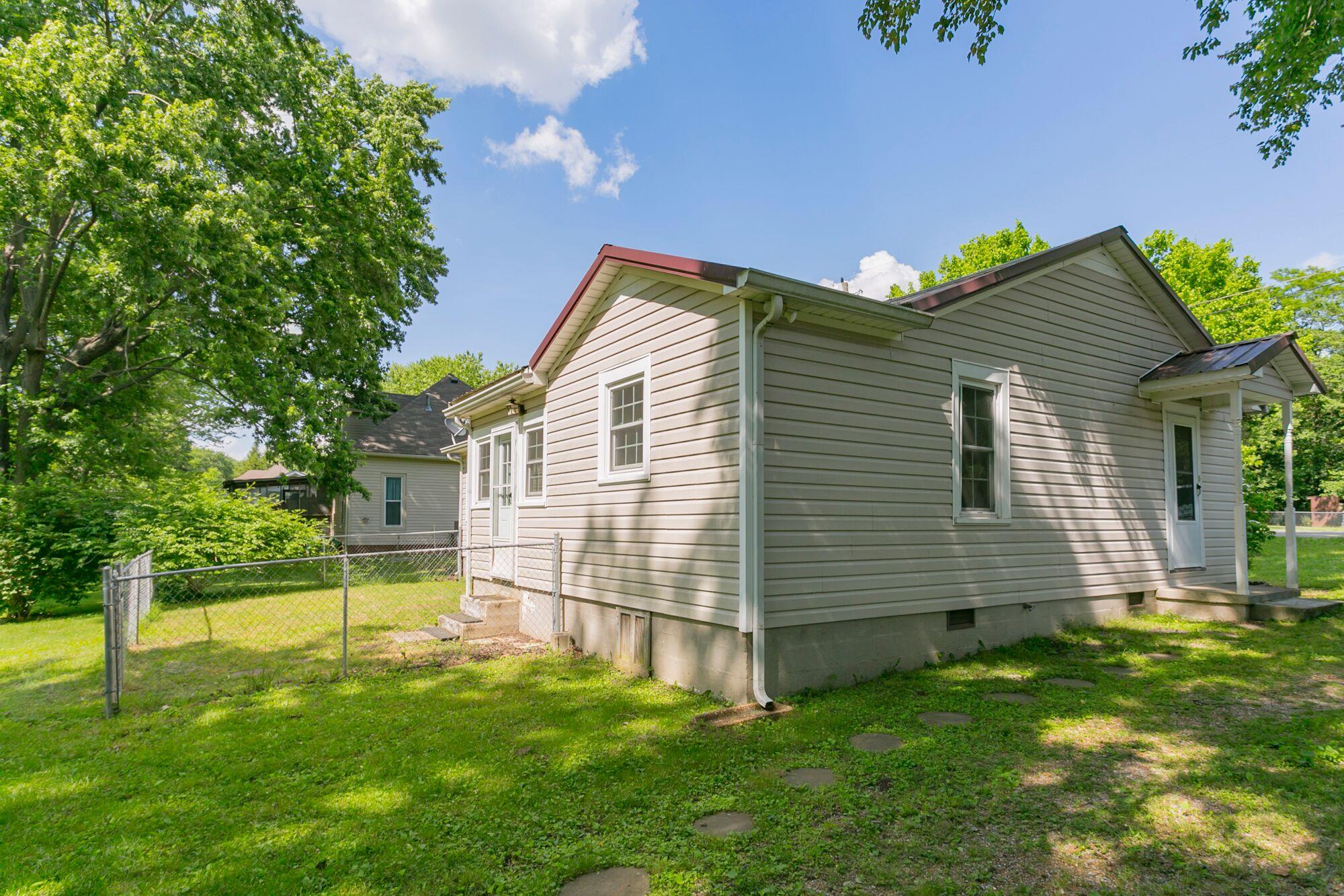 108 North Street Portland, TN 37148 - Photo 18 of 21 a view of a house with a backyard