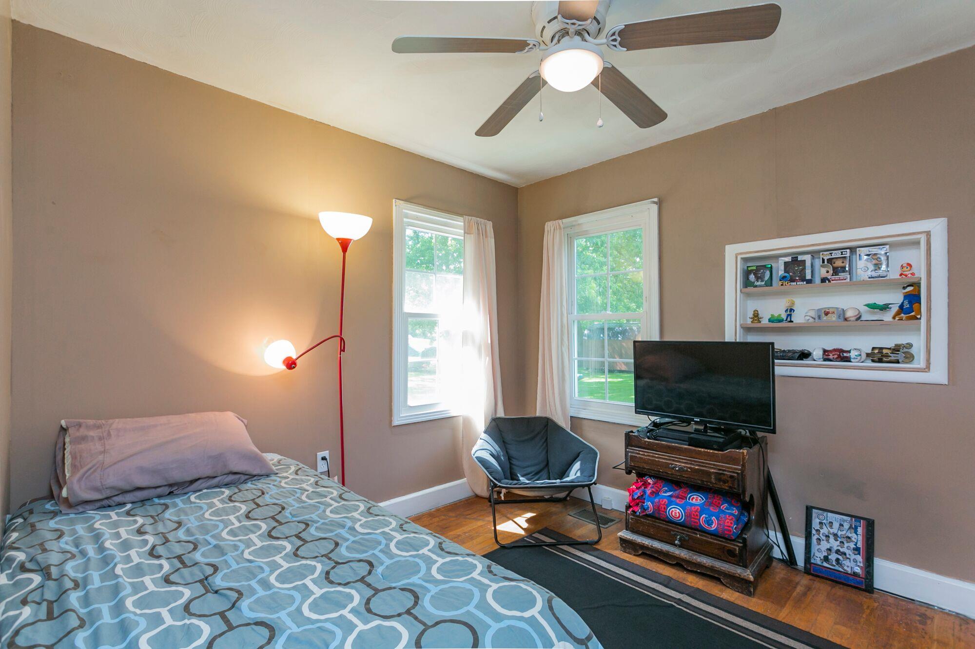 108 North Street Portland, TN 37148 - Photo 7 of 21 a living room with furniture a flat screen tv and a window