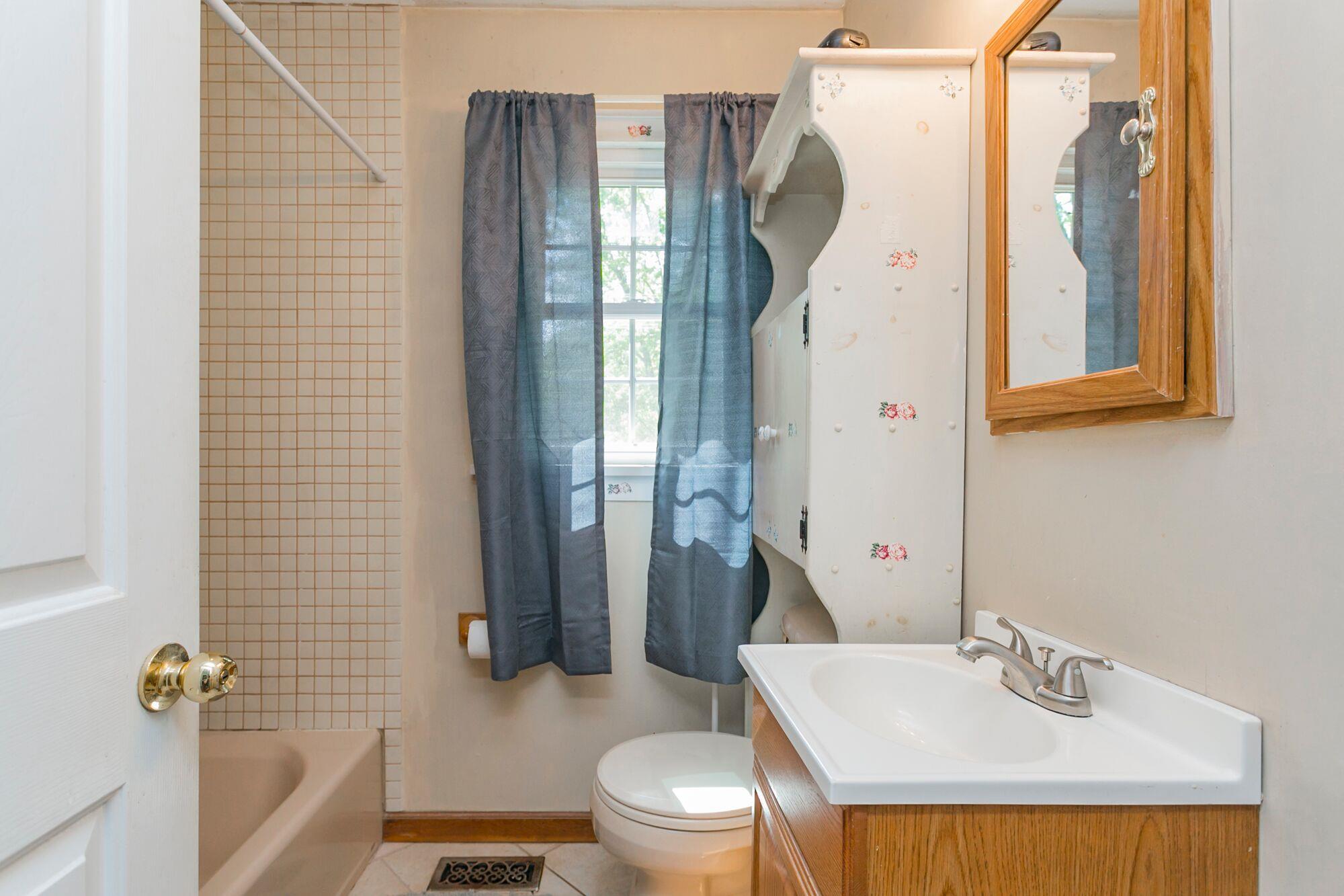 108 North Street Portland, TN 37148 - Photo 9 of 21 a bathroom with a sink toilet and shower