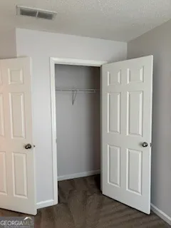 an empty room with wooden floor