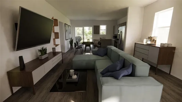 a living room with furniture and a flat screen tv