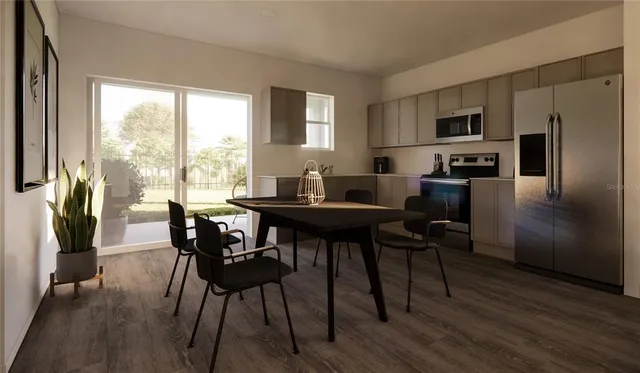 a view of a dining room with furniture window and wooden floor