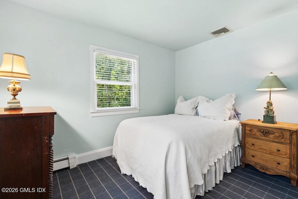 73 Thunder Mountain Road Greenwich, CT 06831 - Photo 12 of 19 a bedroom with a bed and a window