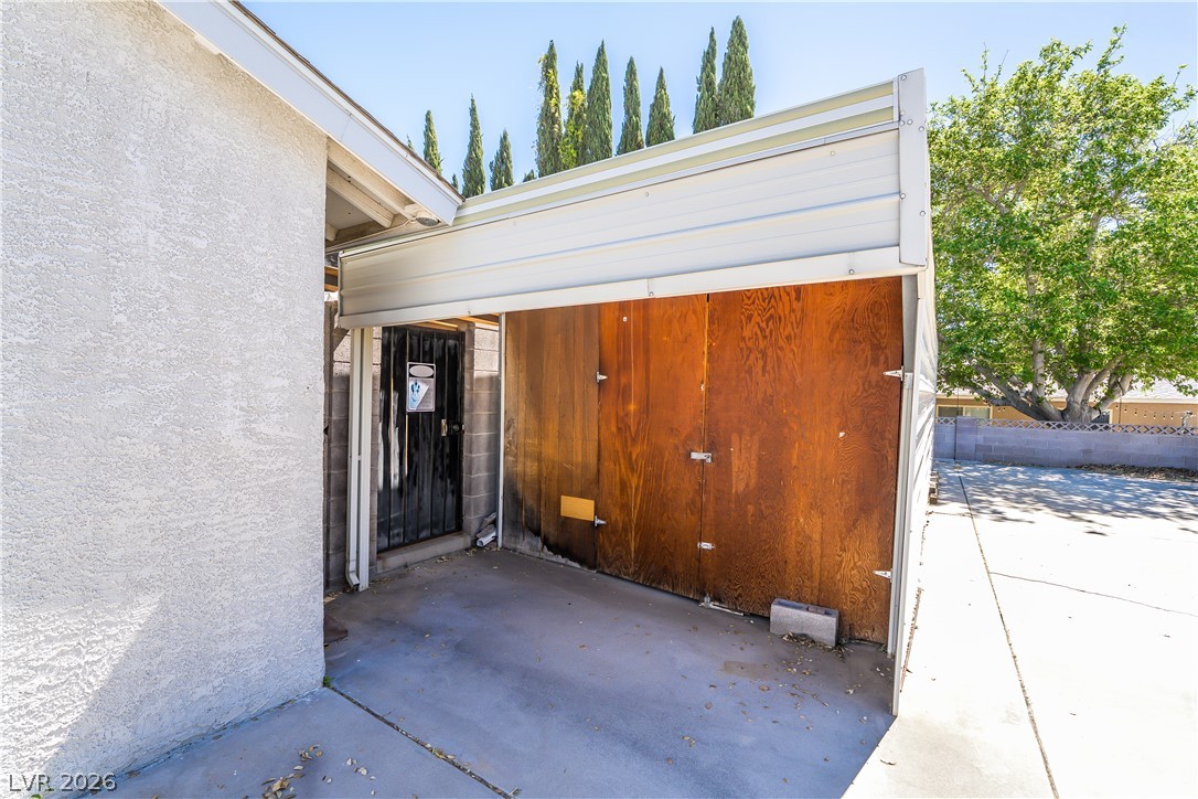 1324 Appaloosa Road Boulder City, NV 89005 - Photo 39 of 42 Concrete slab leading to a secured storage area.