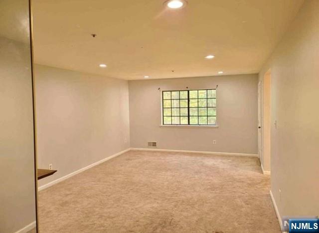1209 Faulkner Court Mahwah, NJ 07430 - Photo 6 of 11 an empty room with windows