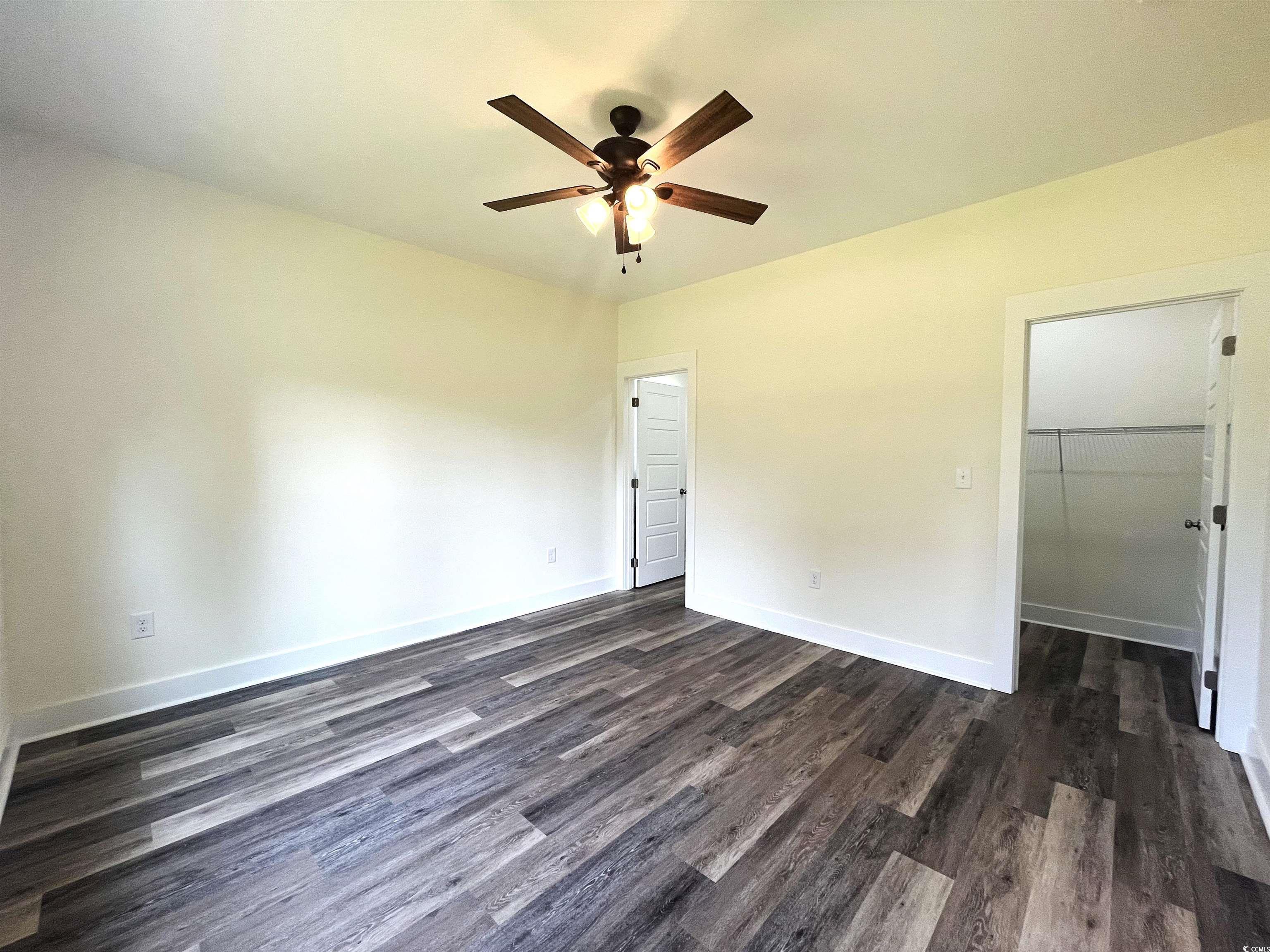 1168 St John Road Galivants Ferry, SC 29544 - Photo 8 of 15 Spare room featuring ceiling fan and dark wood-style floors