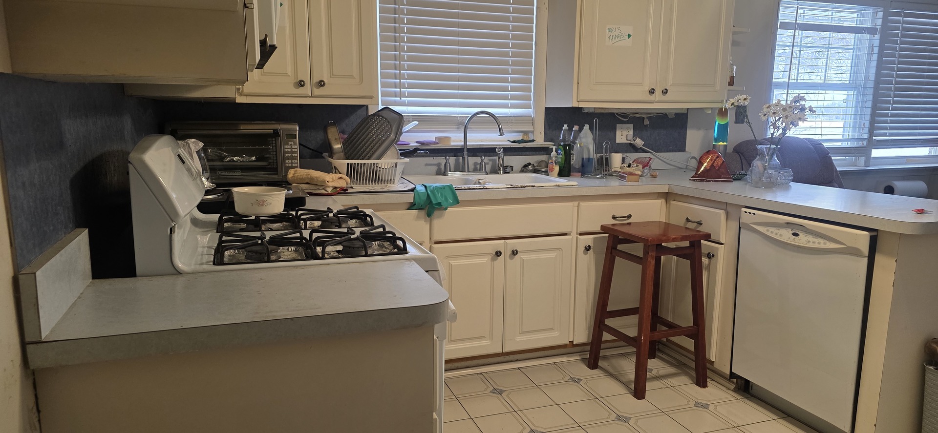 523 8th Street Chicago Heights, IL 60411 - Photo 11 of 31 a kitchen with a sink a stove and a refrigerator