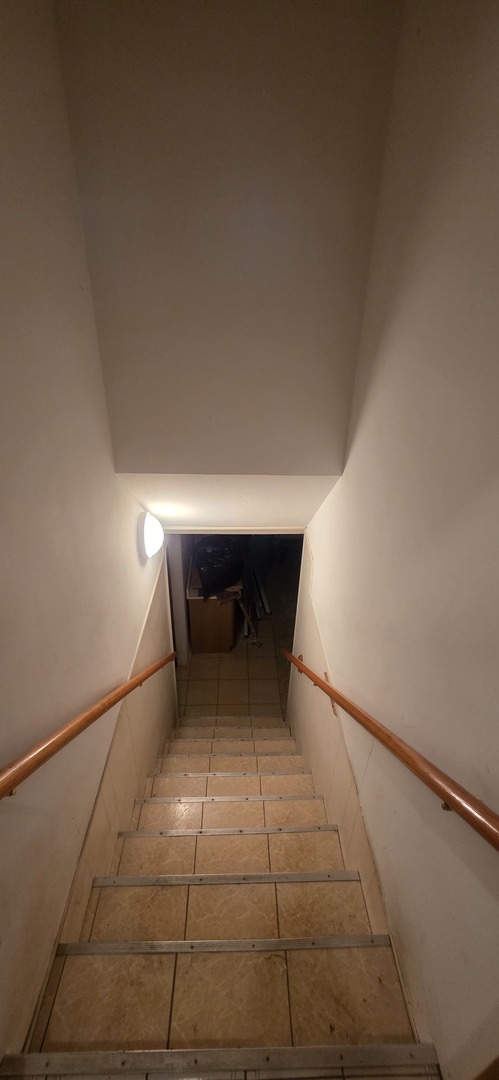 523 8th Street Chicago Heights, IL 60411 - Photo 14 of 31 a room with a sink and a mirror