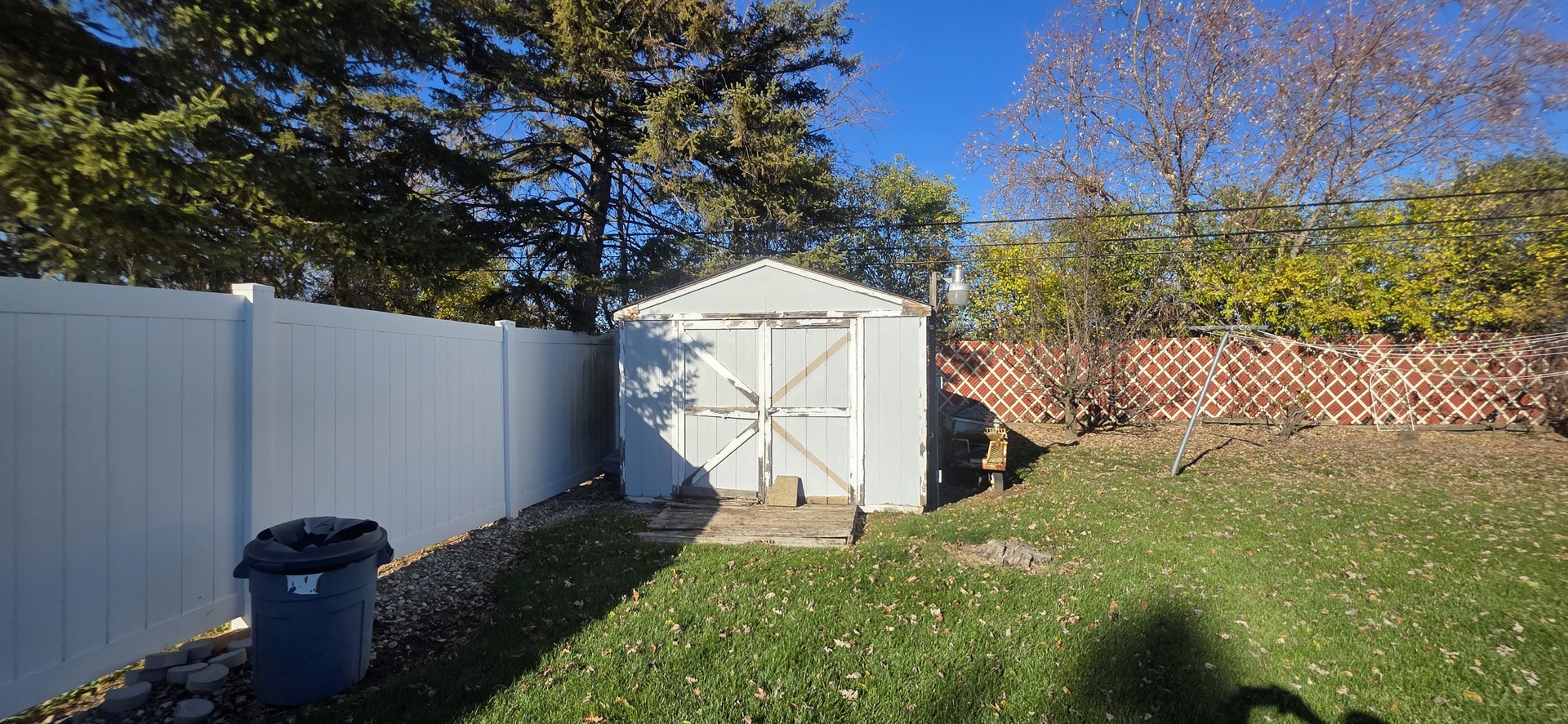 523 8th Street Chicago Heights, IL 60411 - Photo 31 of 31 a garden with trees in front of it