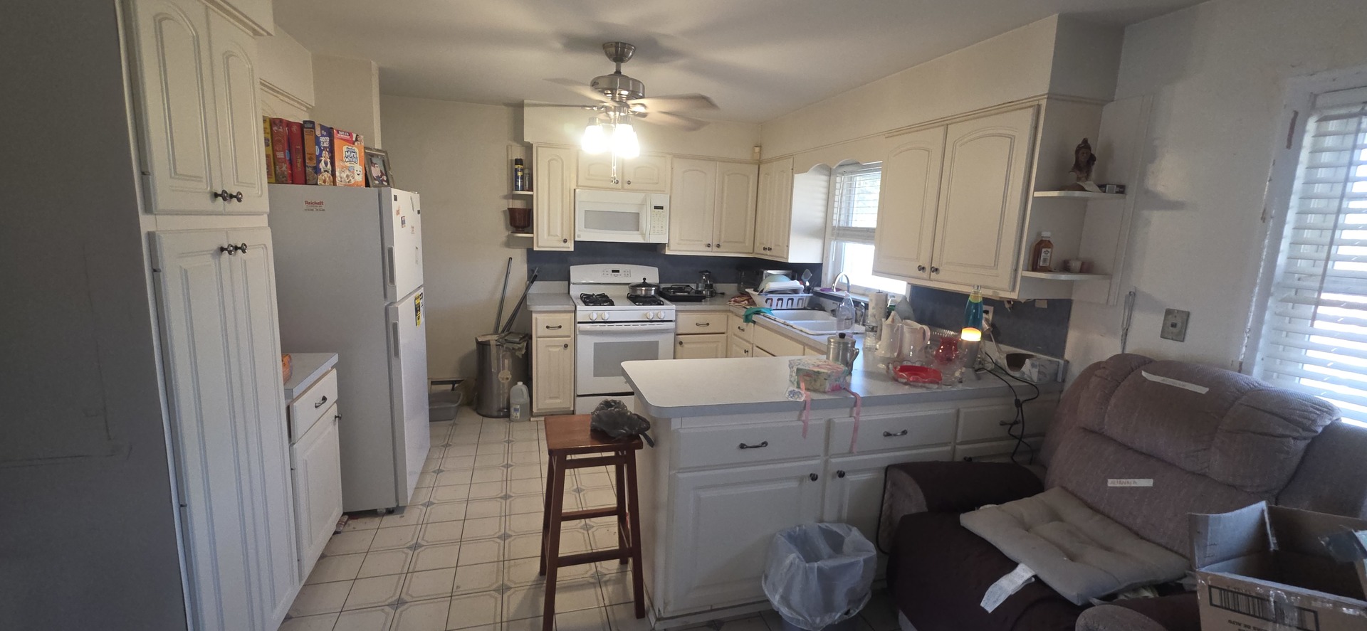 523 8th Street Chicago Heights, IL 60411 - Photo 9 of 31 a room with stainless steel appliances kitchen island granite countertop a refrigerator and a view of living room