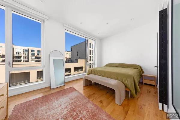 a bedroom with a bed and a fireplace