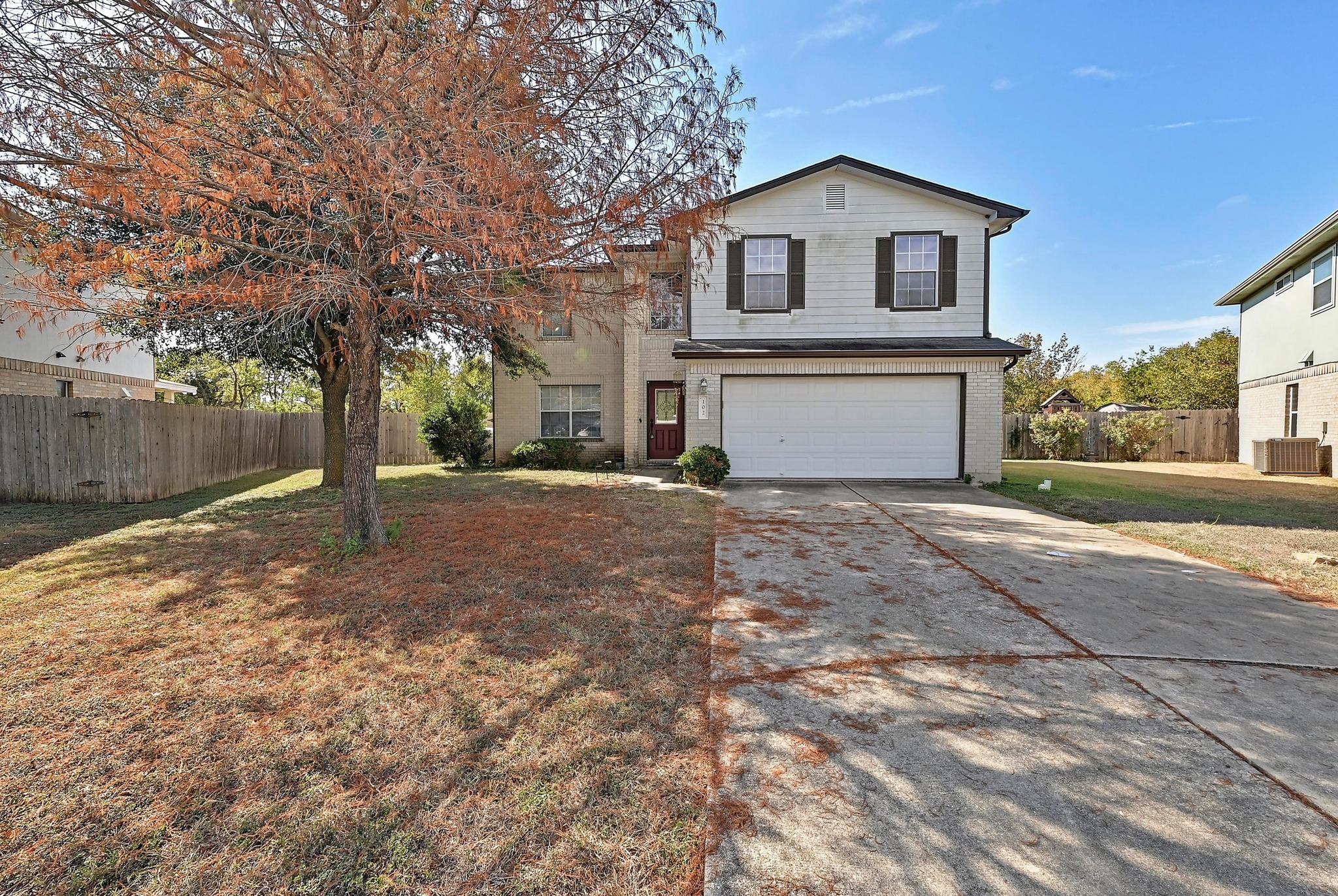 102 Cannery Cove Leander, TX 78641 - Photo 1 of 37 a front view of a house with a yard and garage