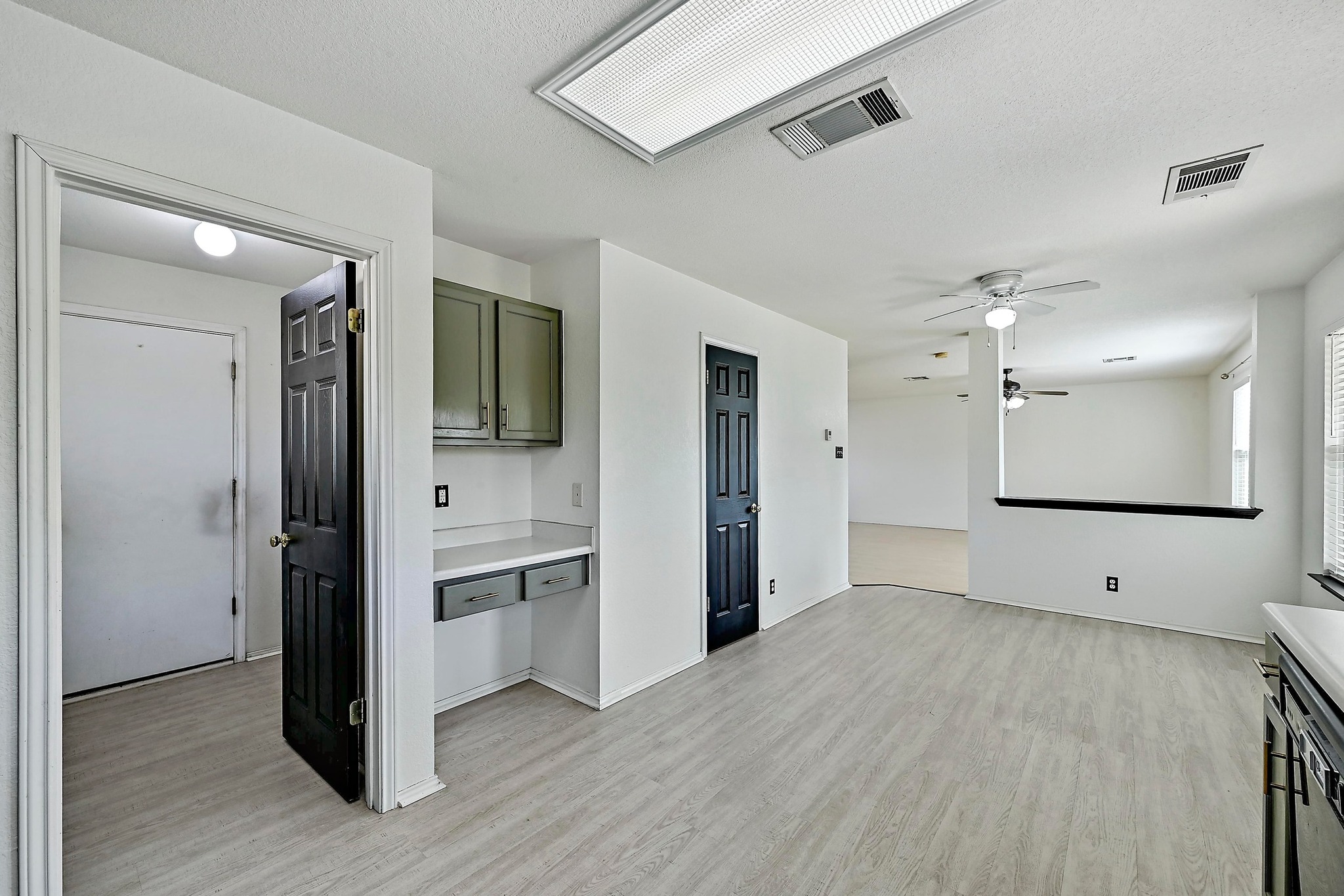 102 Cannery Cove Leander, TX 78641 - Photo 11 of 37 a view of an empty room with kitchen and a window