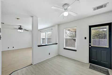 a view of an empty room with a window