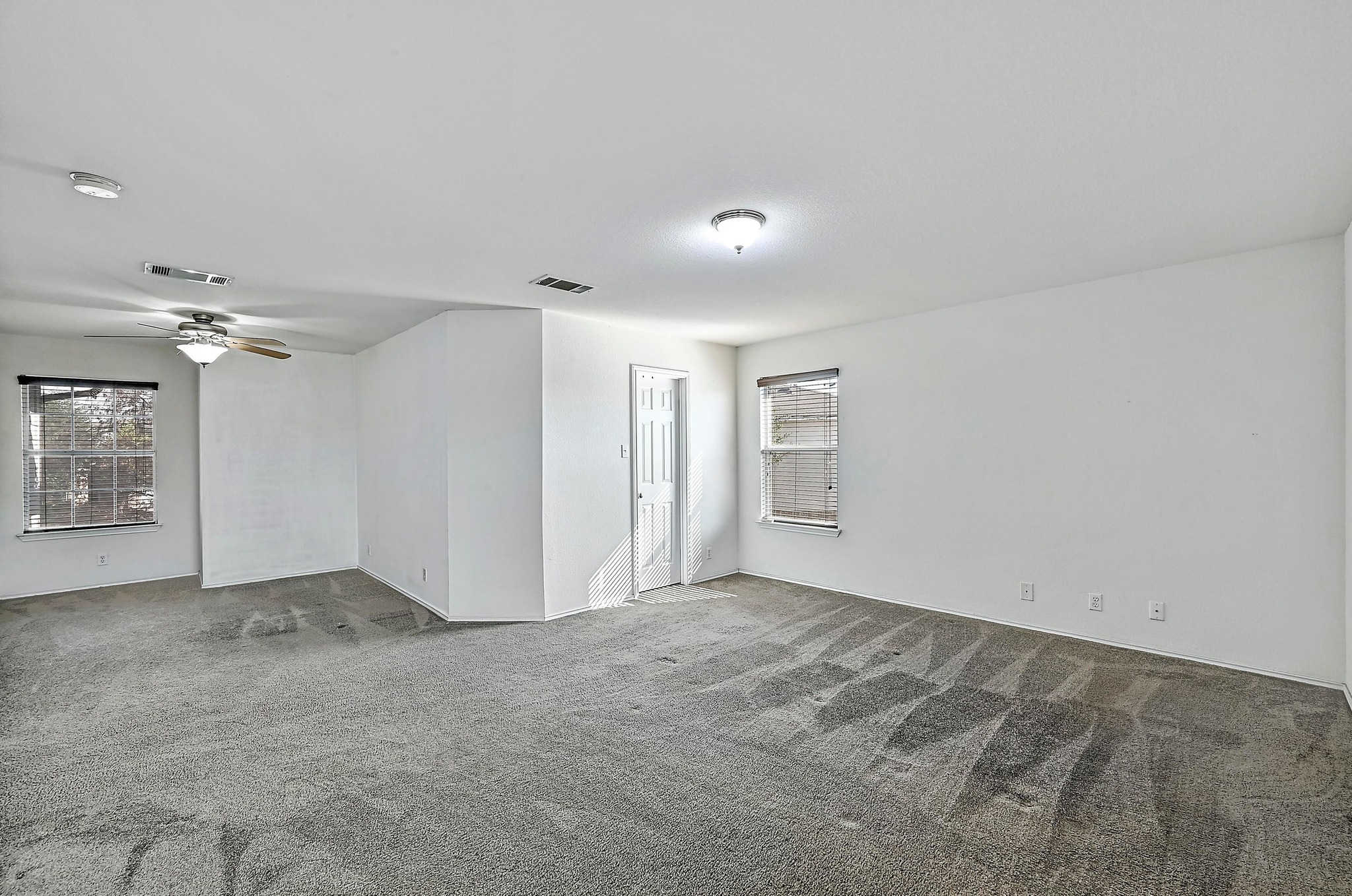 102 Cannery Cove Leander, TX 78641 - Photo 23 of 37 an empty room with windows and cabinet