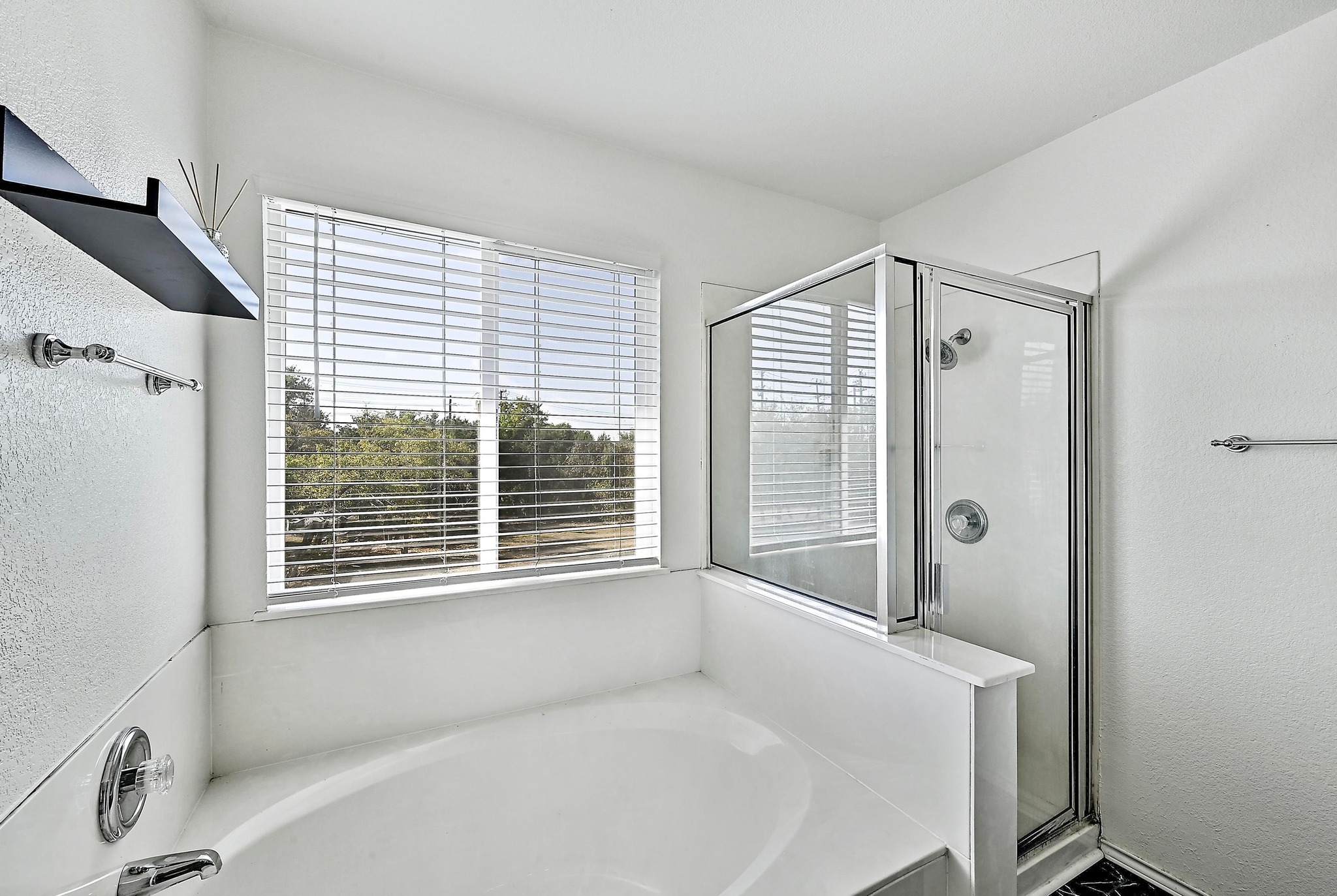 102 Cannery Cove Leander, TX 78641 - Photo 27 of 37 a bathroom with a bathtub and a shower