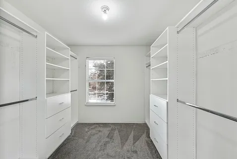 a view of an empty walk in closet