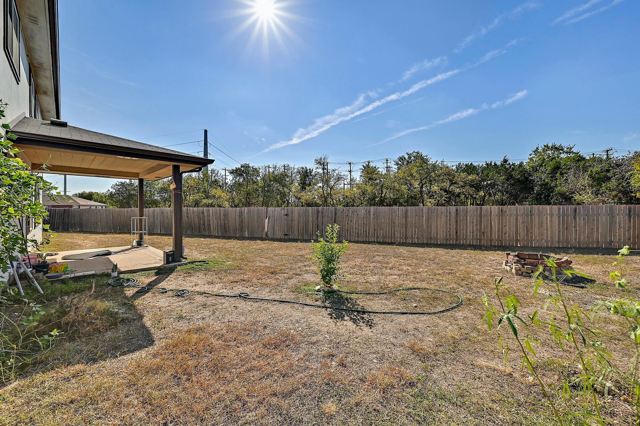 102 Cannery Cove Leander, TX 78641 - Photo 33 of 37 a view of a backyard with a slide and a swing