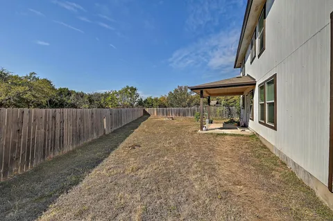 a view of a backyard with pathway