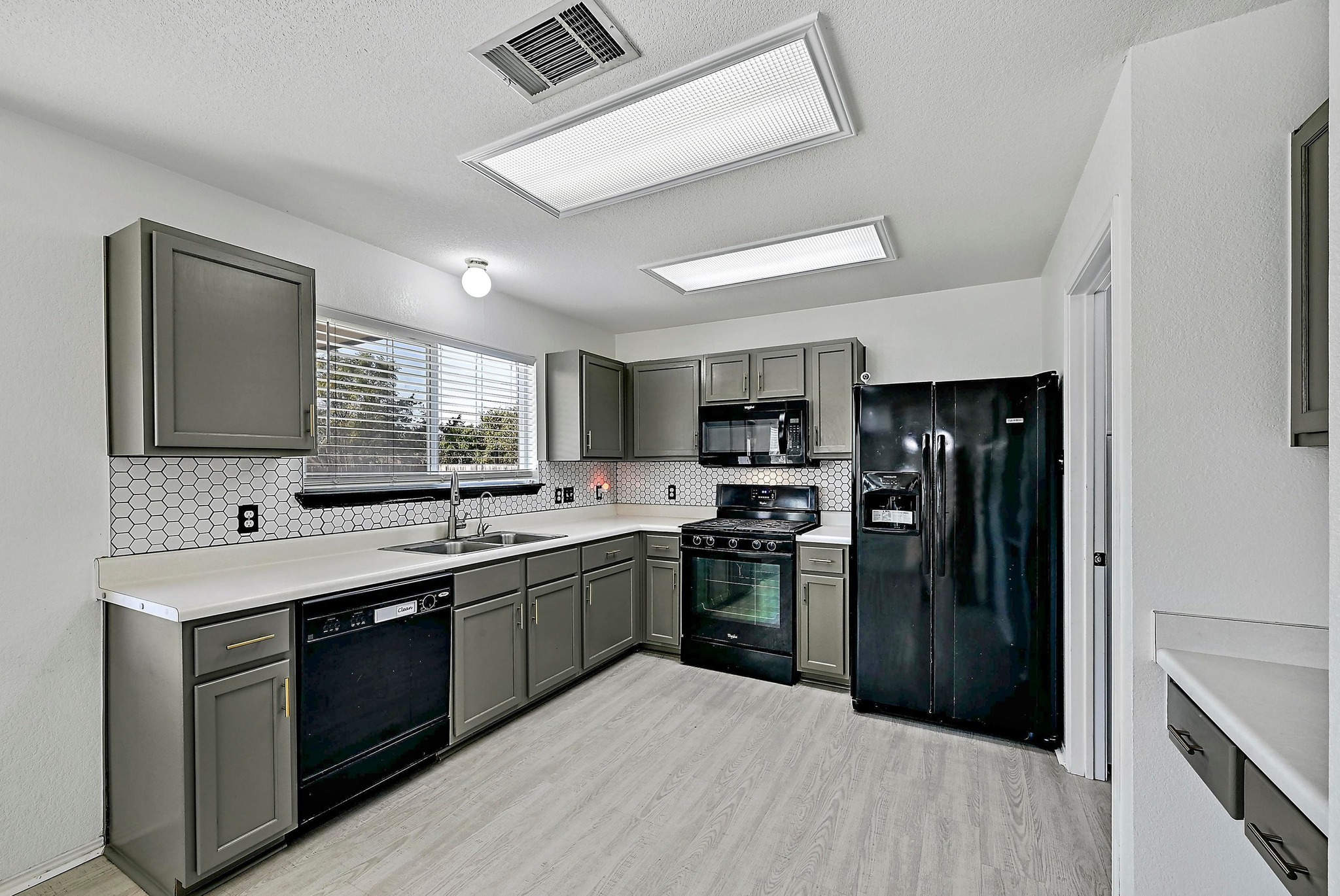 102 Cannery Cove Leander, TX 78641 - Photo 9 of 37 a kitchen with stainless steel appliances granite countertop a refrigerator and a sink