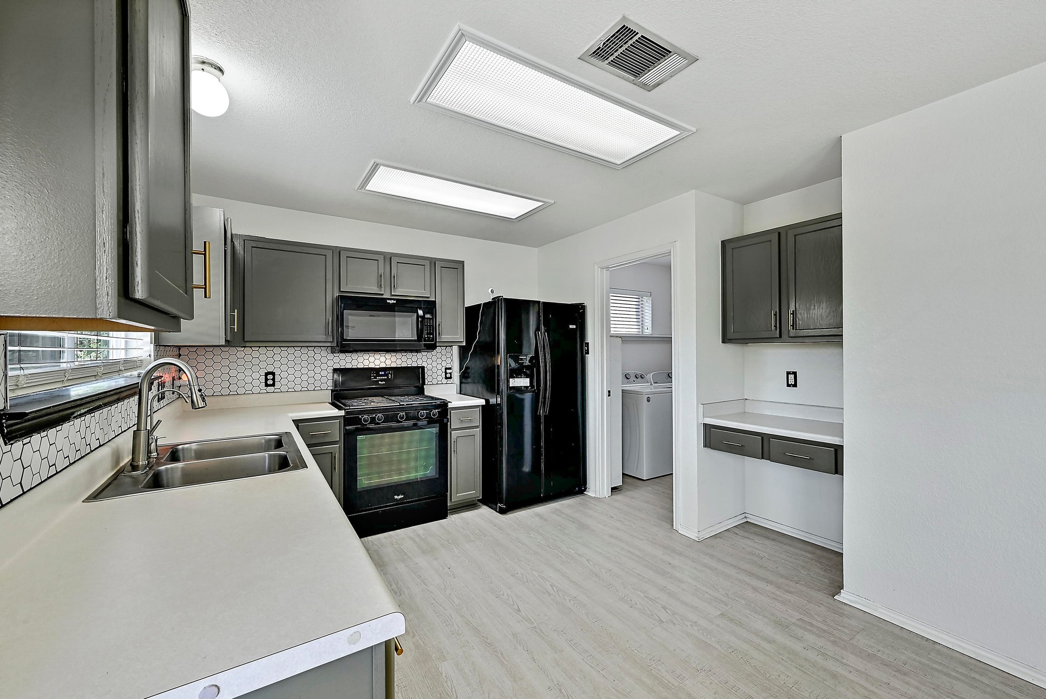 102 Cannery Cove Leander, TX 78641 - Photo 10 of 37 a kitchen with stainless steel appliances a refrigerator and a stove top oven