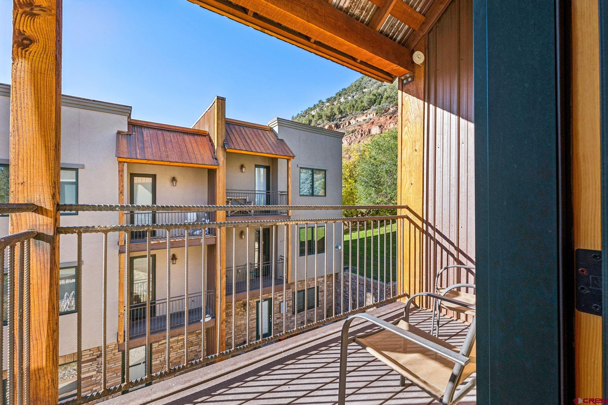 1422 Animas View Drive, Unit 55 Durango, CO 81301 - Photo 4 of 44 a view of a brick house with large windows