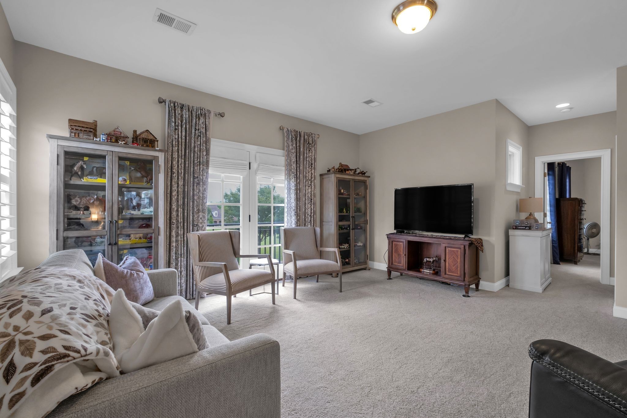 2505 Upper Hollow Road Thompson's Station, TN 37179 - Photo 34 of 52 a living room with furniture and a flat screen tv