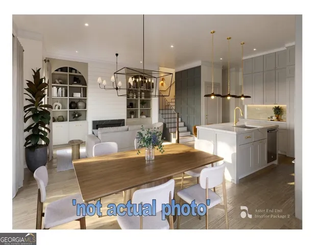 a kitchen with stainless steel appliances kitchen island granite countertop a table chairs and a refrigerator